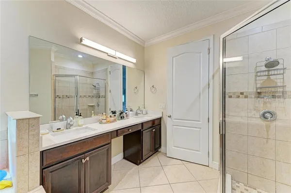 a bedroom with a bed and a chair