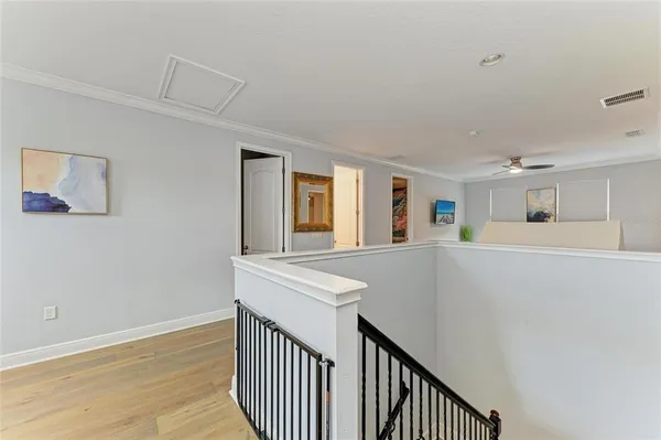 a bedroom with a bed and flat screen tv