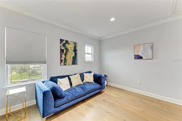 a bedroom with a bed and a television