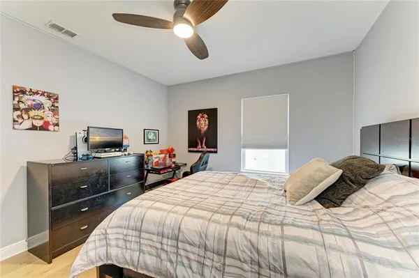 an aerial view of a house with a yard and lake view