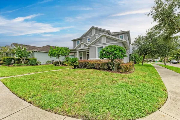 a view of a hallway with wooden floor and entryway