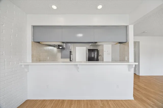 a view of a living room with a wooden floor