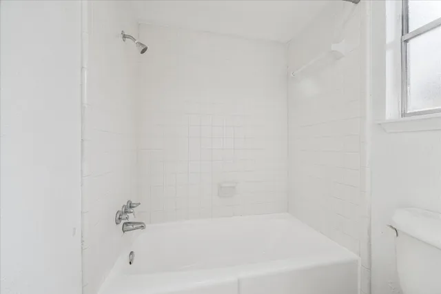 a close up of a bathtub curtain