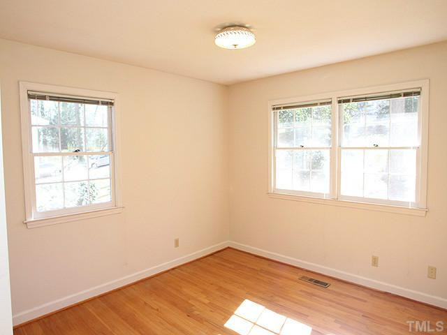 4512 Connell Drive Raleigh, NC 27612 - Photo 12 of 25 lovely view of quiet tree-lined street in established Oak Park Bedroom