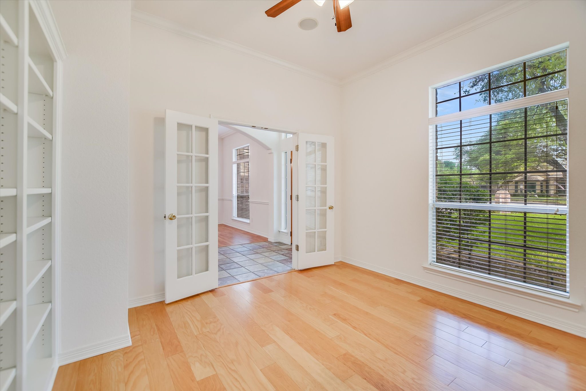 109 Stacey Cove Georgetown, TX 78628 - Photo 6 of 22 Office/ bonus space with french doors, high ceilings, built-in bookshelves.