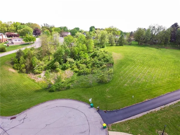 a view of a golf course with a garden