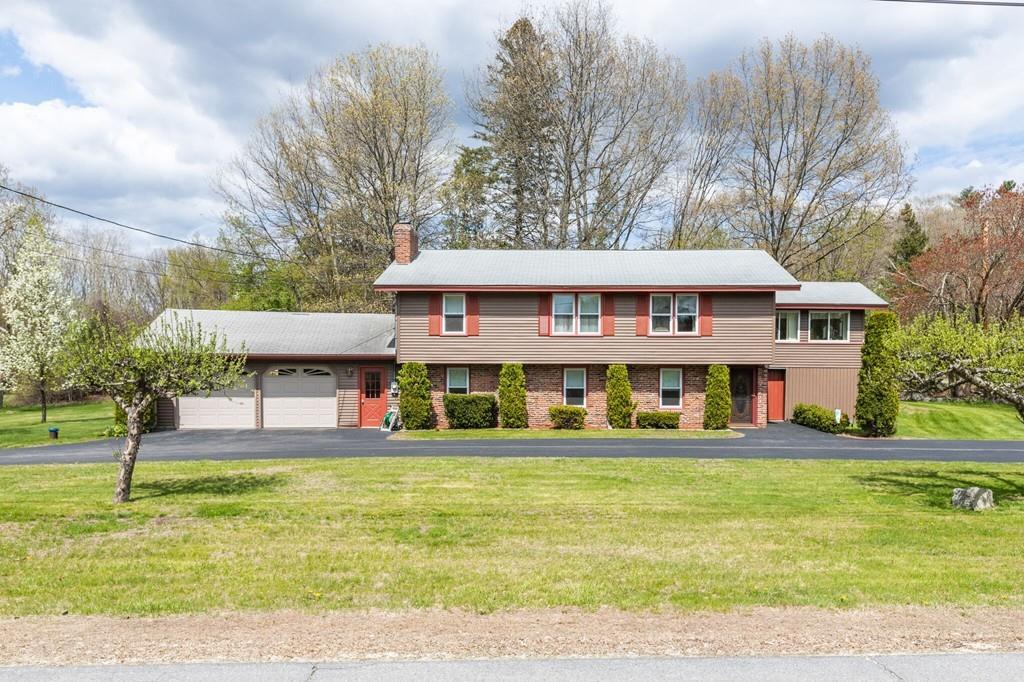 2 Old County Road Pelham, NH 03076 - Photo 1 of 38 a view of a house with a swimming pool