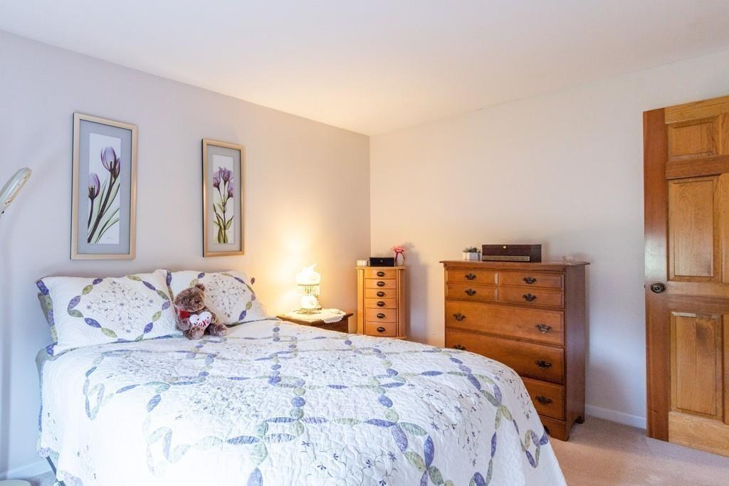 2 Old County Road Pelham, NH 03076 - Photo 20 of 38 a bedroom with a bed and a closet