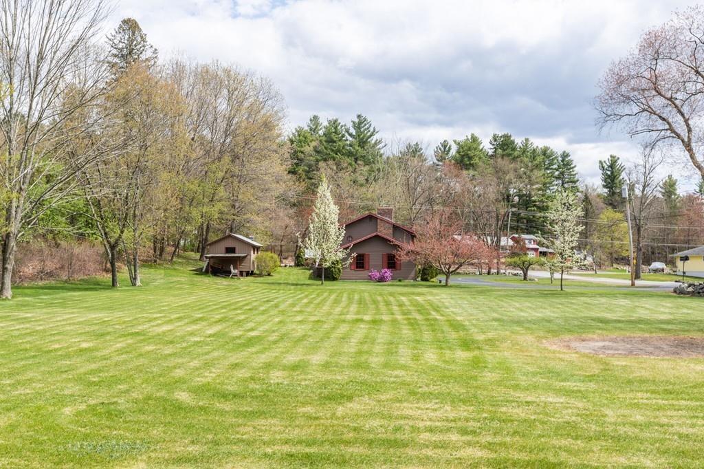 2 Old County Road Pelham, NH 03076 - Photo 32 of 38 a front view of a house with a yard and trees