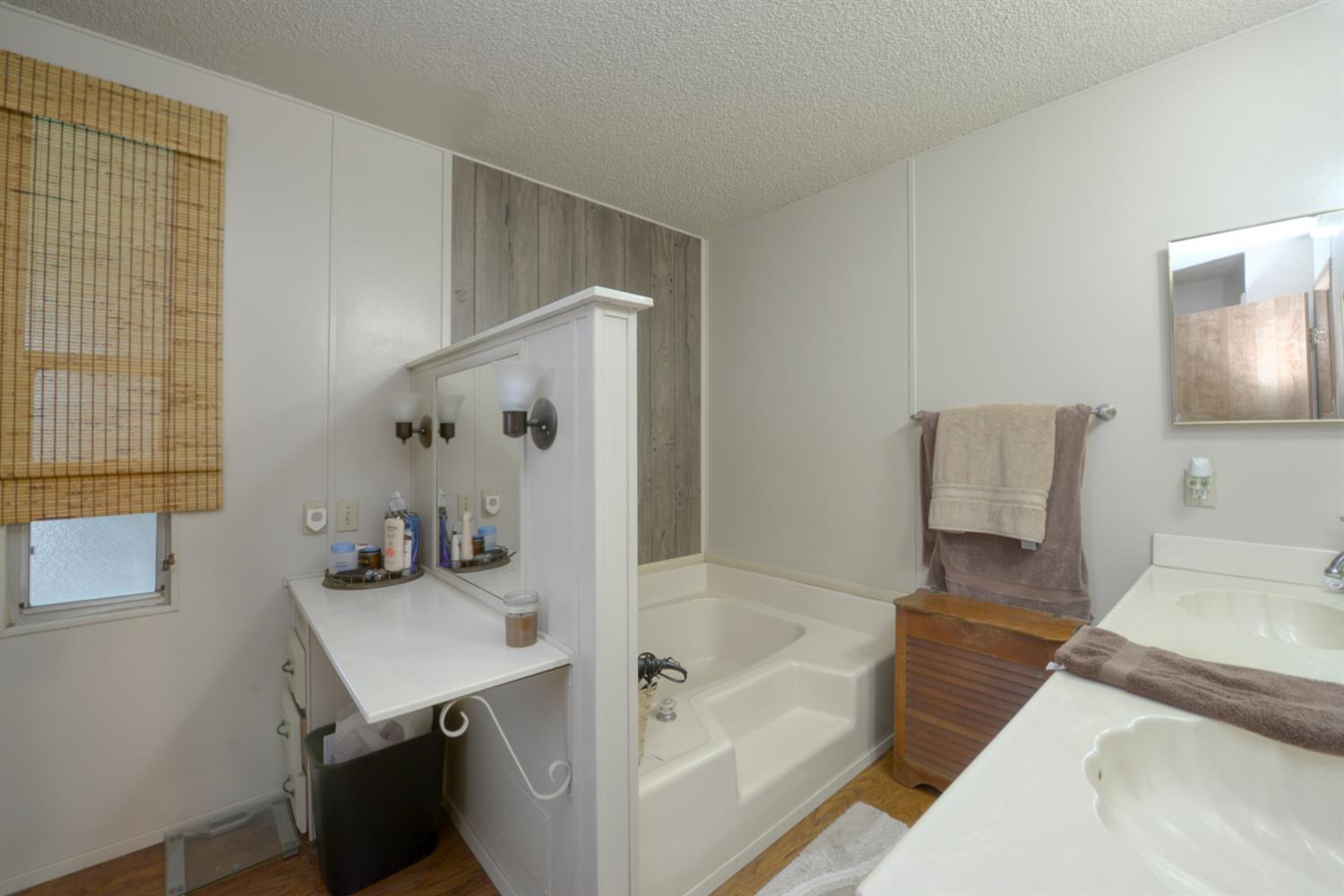 1471 Highway 33 Gustine, CA 95322 - Photo 48 of 57 a bathroom with a tub sink and mirror