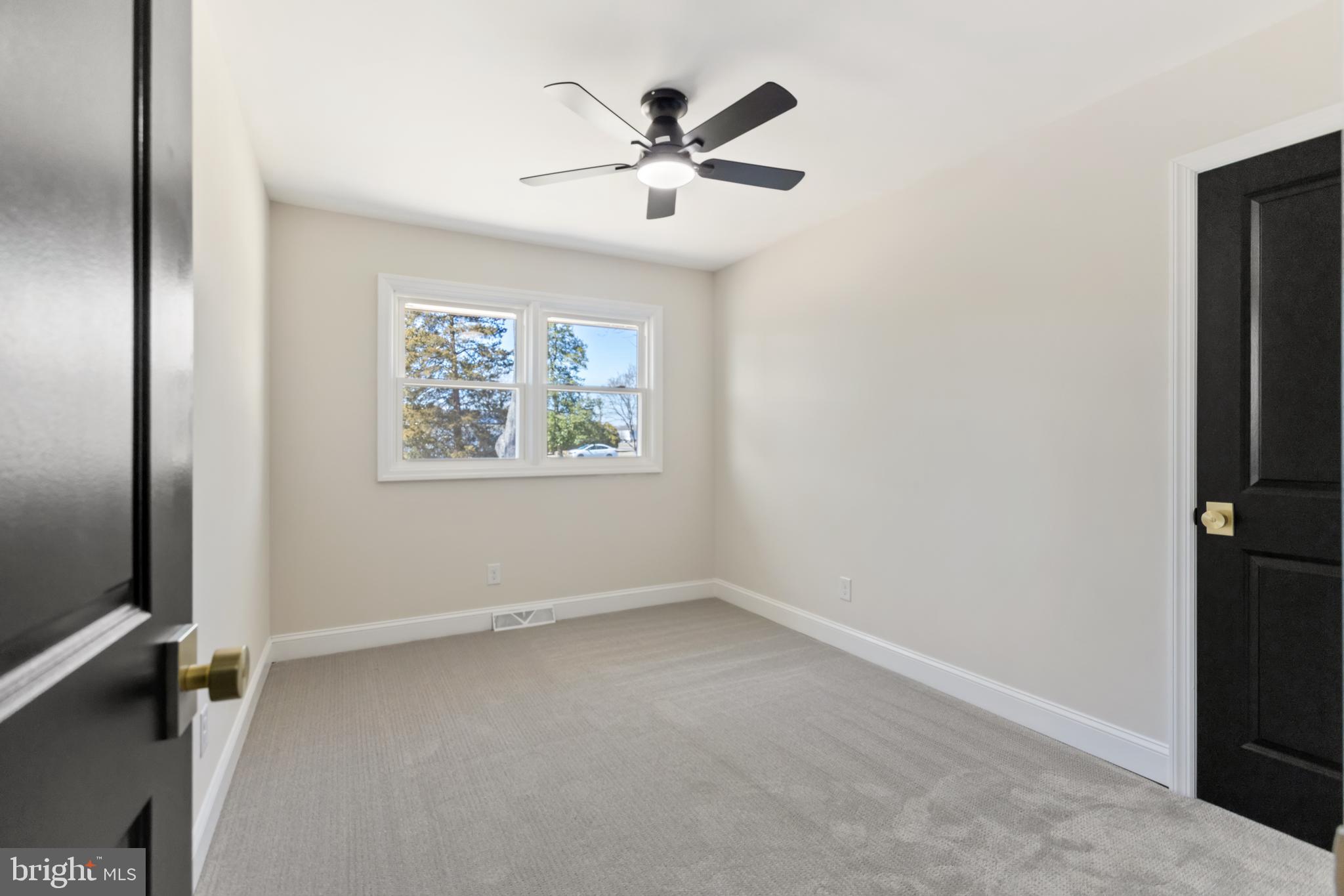 7 Maple Road Eastampton, NJ 08060 - Photo 41 of 62 an empty room with ceiling fan and windows