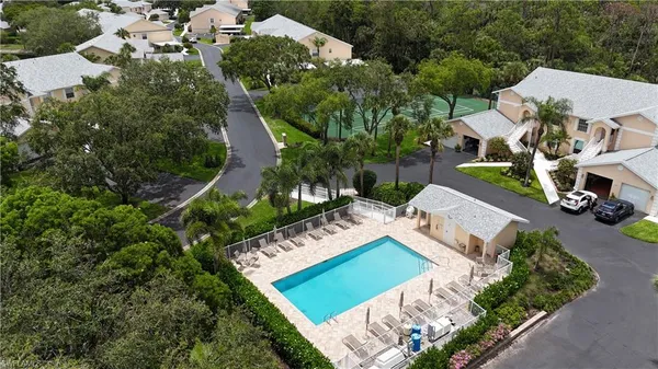 an aerial view of a house with garden space and street view