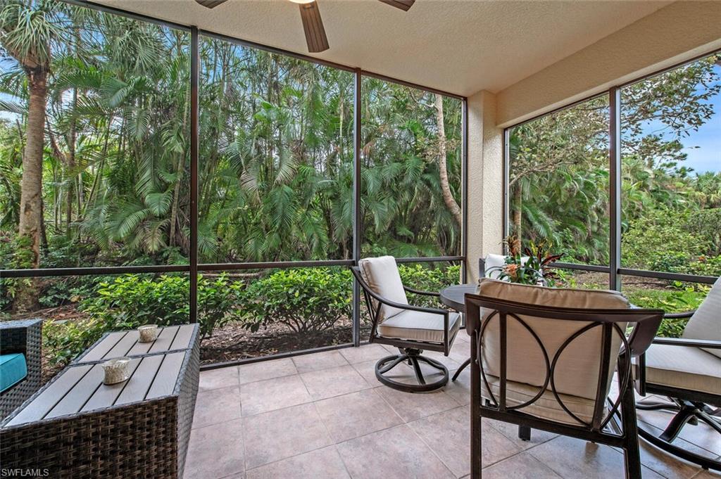1035 Sandpiper Street, Unit F104 Naples, FL 34102 - Photo 15 of 24 a view of a chairs and table in the patio