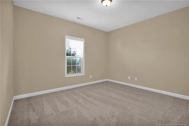 a bathroom with a granite countertop sink toilet a mirror and shower