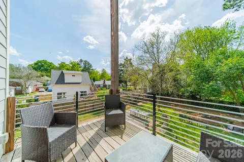 a view of a chairs and table in the balcony