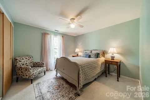 a bed room with a bed and a window