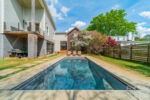 a view of swimming pool with a yard