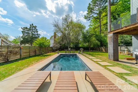 a view of swimming pool with a patio