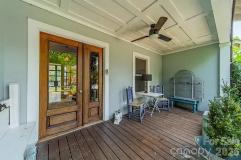a view of a livingroom with furniture and hardwood floor