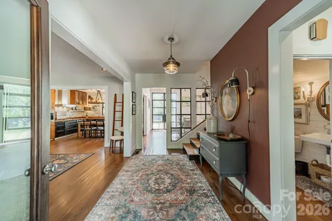 workspace with wooden floor mirror and windows