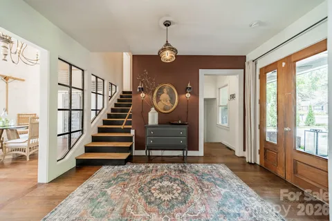 a view of entryway with wooden floor and a rug