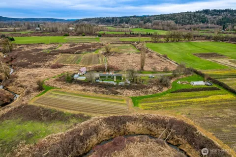 a view of a field with an ocean view