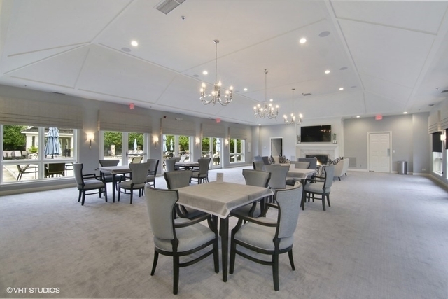 857 Country Club Lane Northbrook, IL 60062 - Photo 18 of 27 a view of a dining area with furniture and chandelier