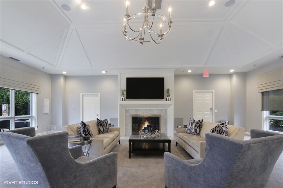 857 Country Club Lane Northbrook, IL 60062 - Photo 19 of 27 a living room with furniture a flat screen tv and a fireplace