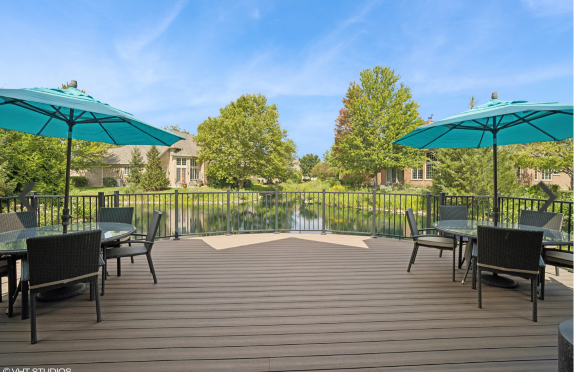 857 Country Club Lane Northbrook, IL 60062 - Photo 25 of 27 a view of a table and chairs under an umbrella