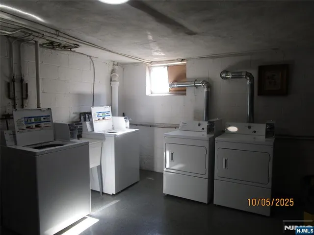 a kitchen with a sink cabinets and appliances