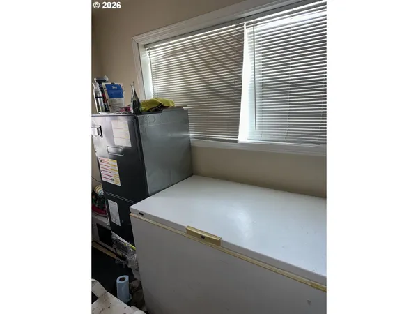 a kitchen with a sink and stainless steel appliances