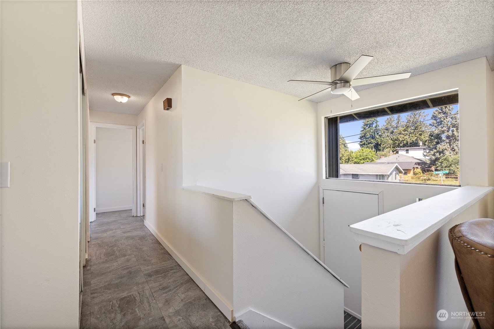 3127 South Walden Street Seattle, WA 98144 - Photo 13 of 39 a view of hallway with window and a ceiling fan