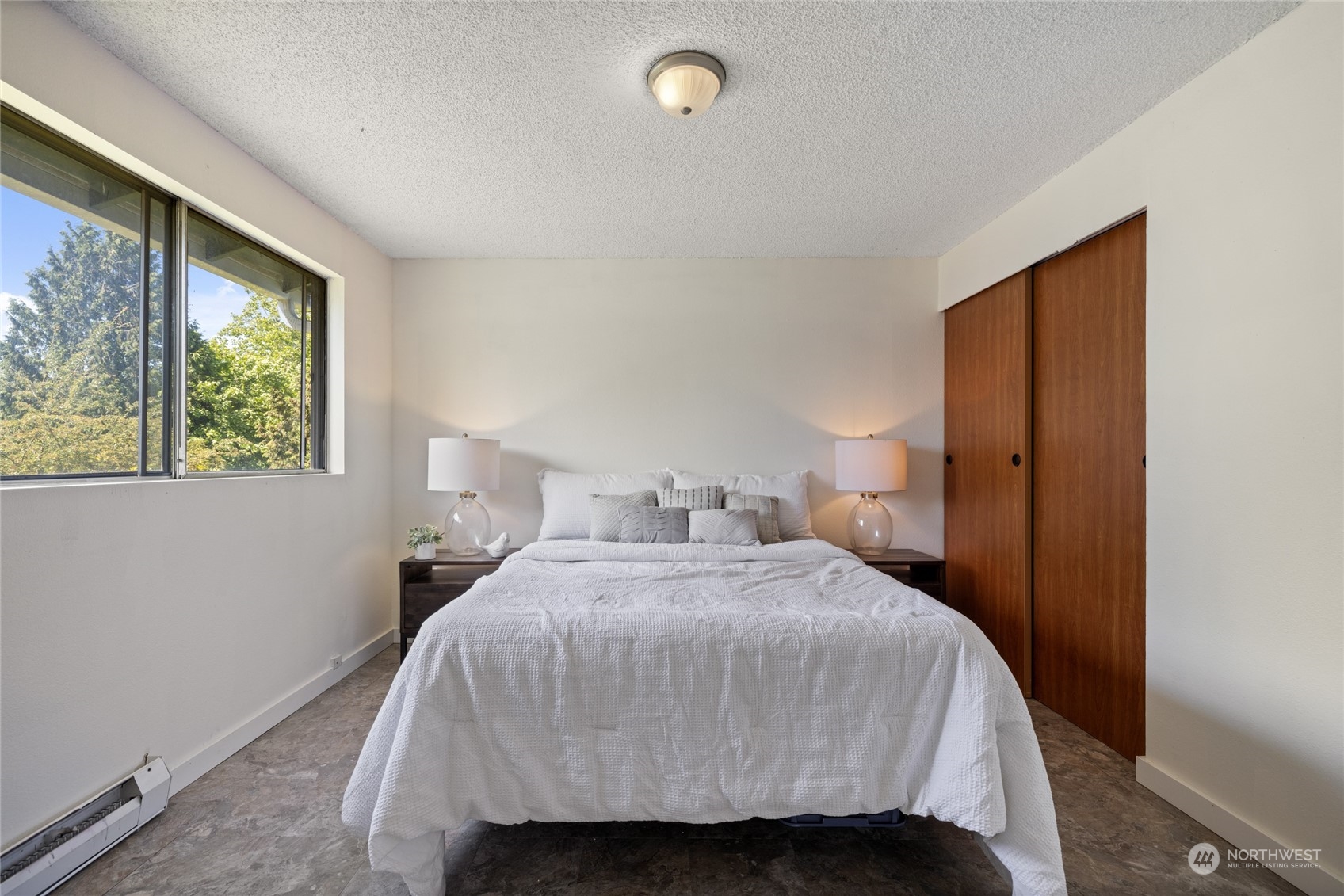 3127 South Walden Street Seattle, WA 98144 - Photo 14 of 39 a bedroom with a bed and a window
