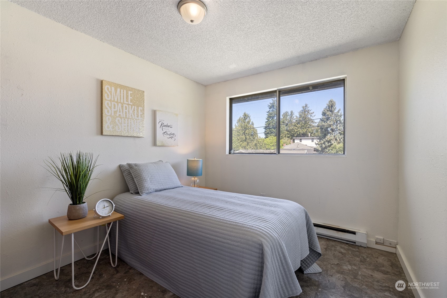 3127 South Walden Street Seattle, WA 98144 - Photo 16 of 39 a bedroom with a large bed and a potted plant