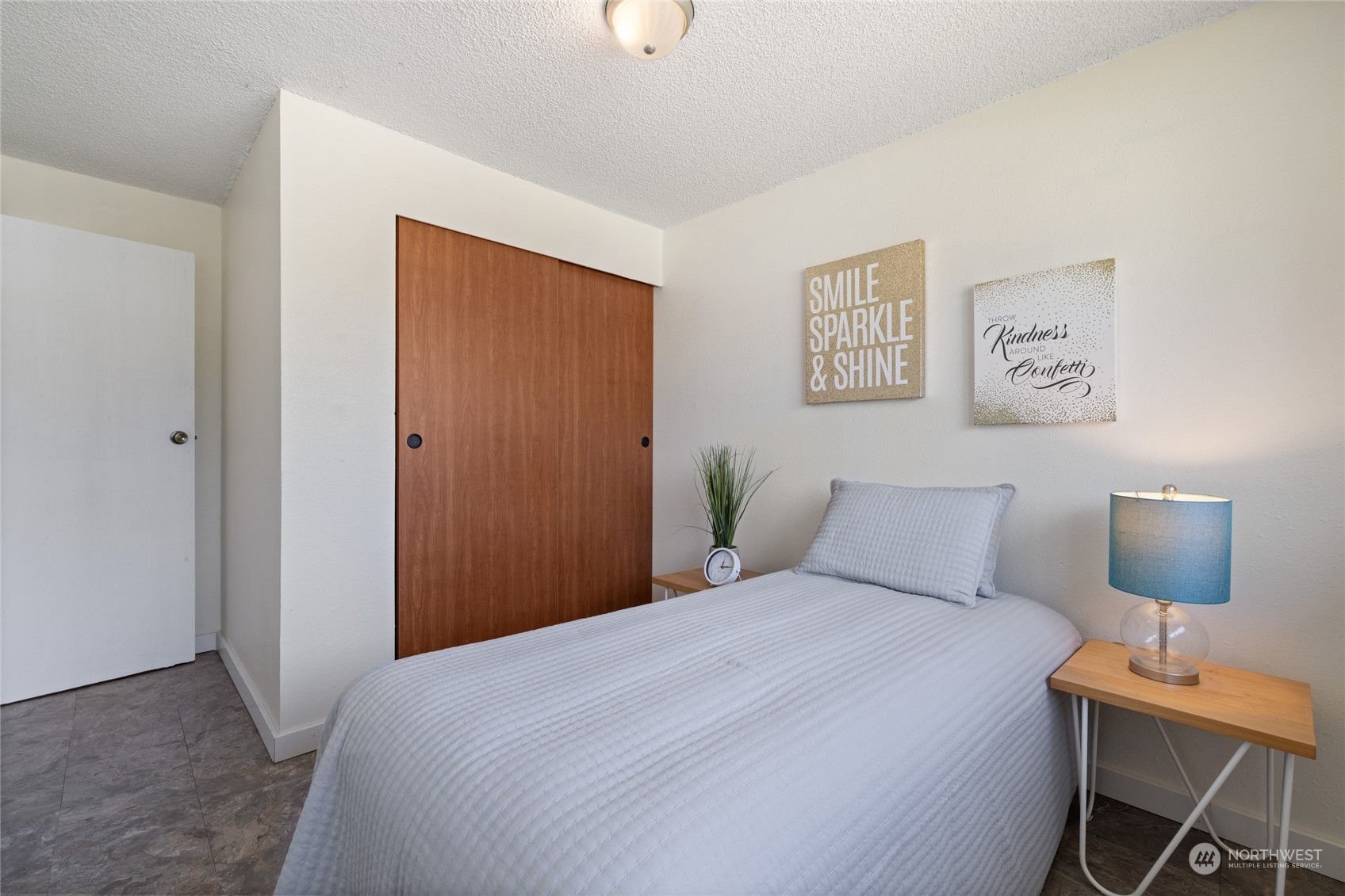 3127 South Walden Street Seattle, WA 98144 - Photo 17 of 39 a bedroom with a bed and a table in it