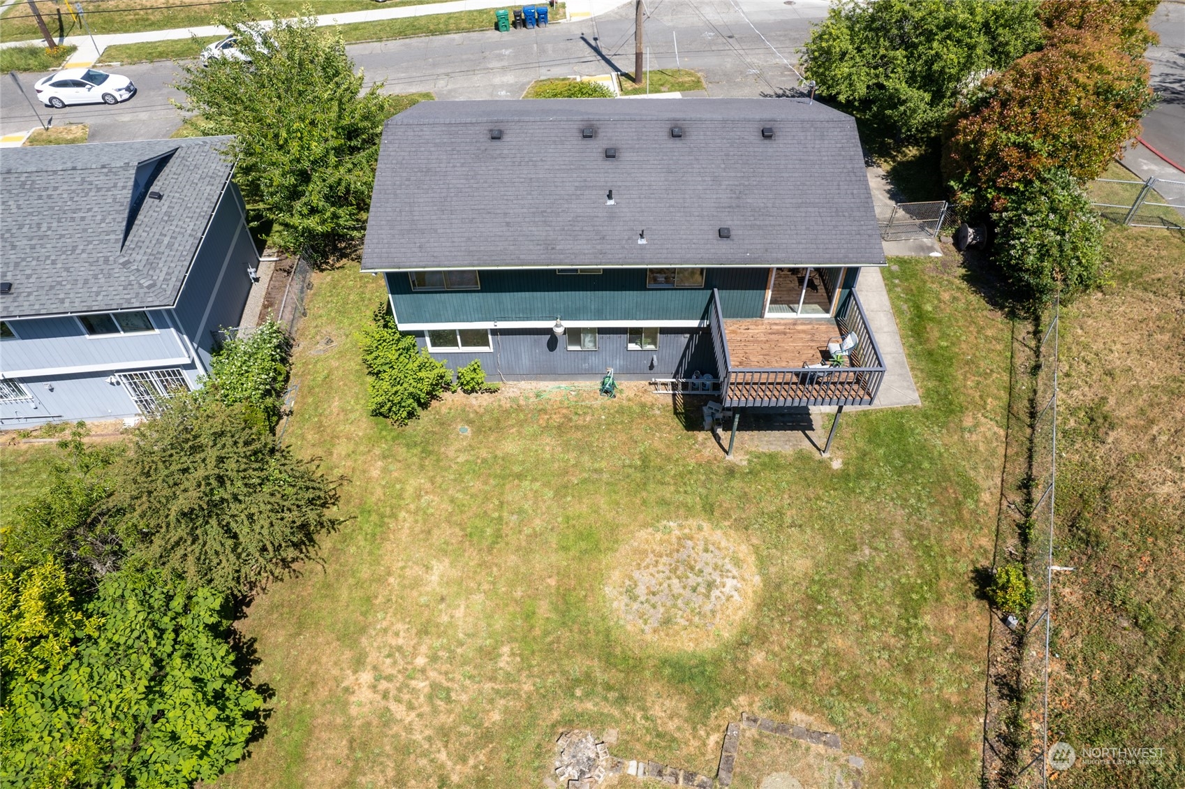 3127 South Walden Street Seattle, WA 98144 - Photo 36 of 39 a aerial view of a house with table and chairs and potted plants