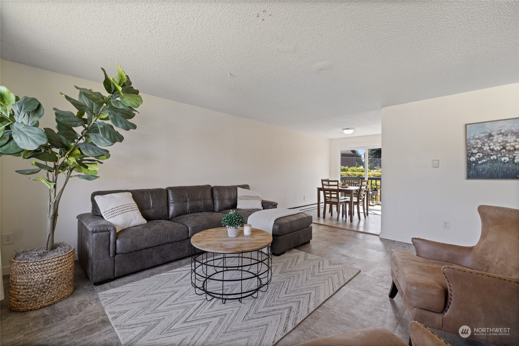 3127 South Walden Street Seattle, WA 98144 - Photo 9 of 39 a living room with furniture and a potted plant