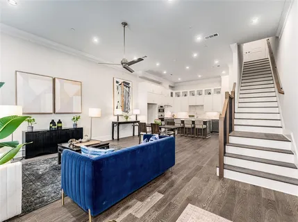 a kitchen with sink refrigerator and cabinets
