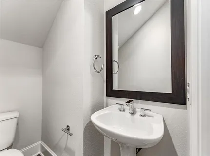 a bathroom with a sink and a toilet
