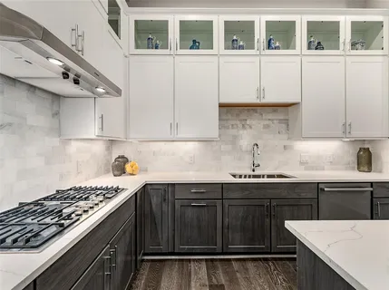 a kitchen with a sink and cabinets
