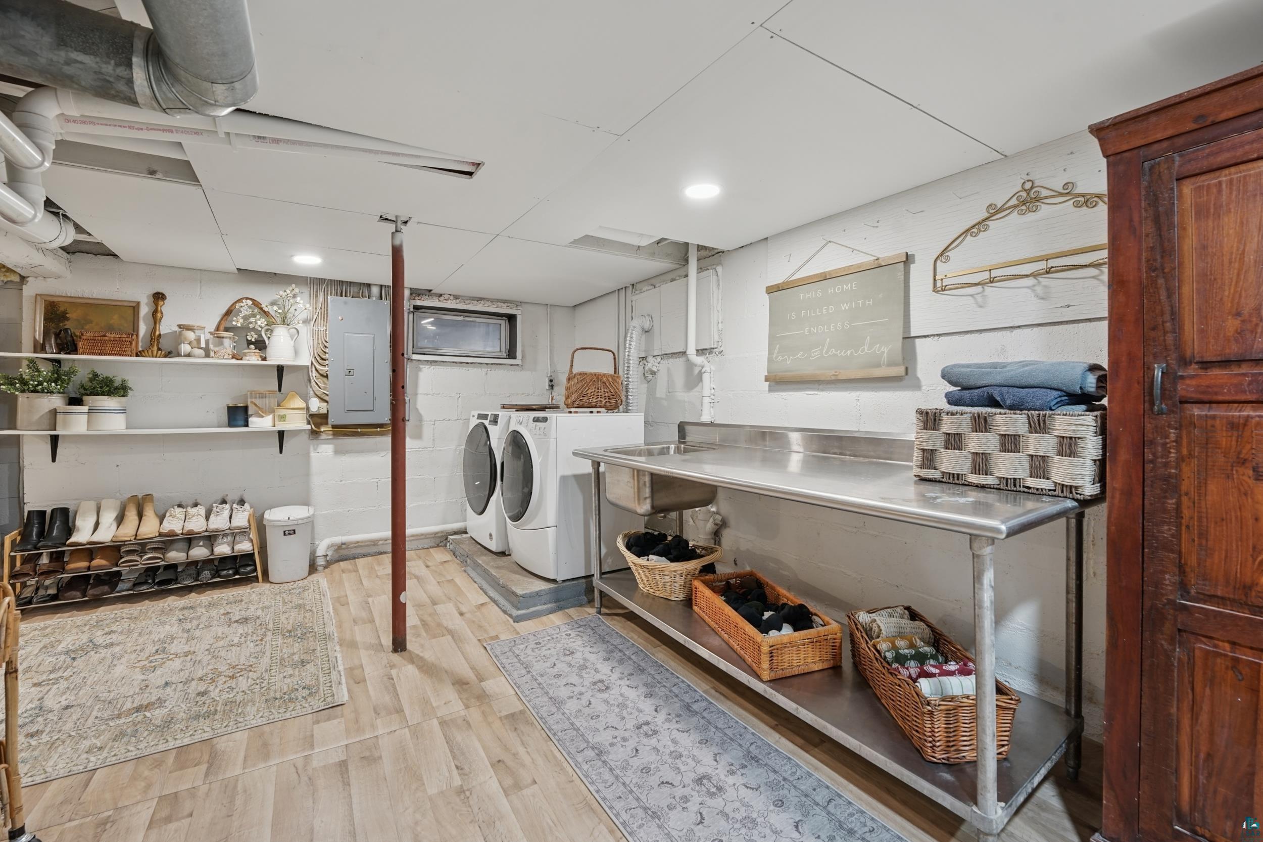 52 Thomson Road Esko, MN 55733 - Photo 15 of 20 Laundry room featuring washer and clothes dryer, electric panel, light wood-type flooring, and recessed lighting