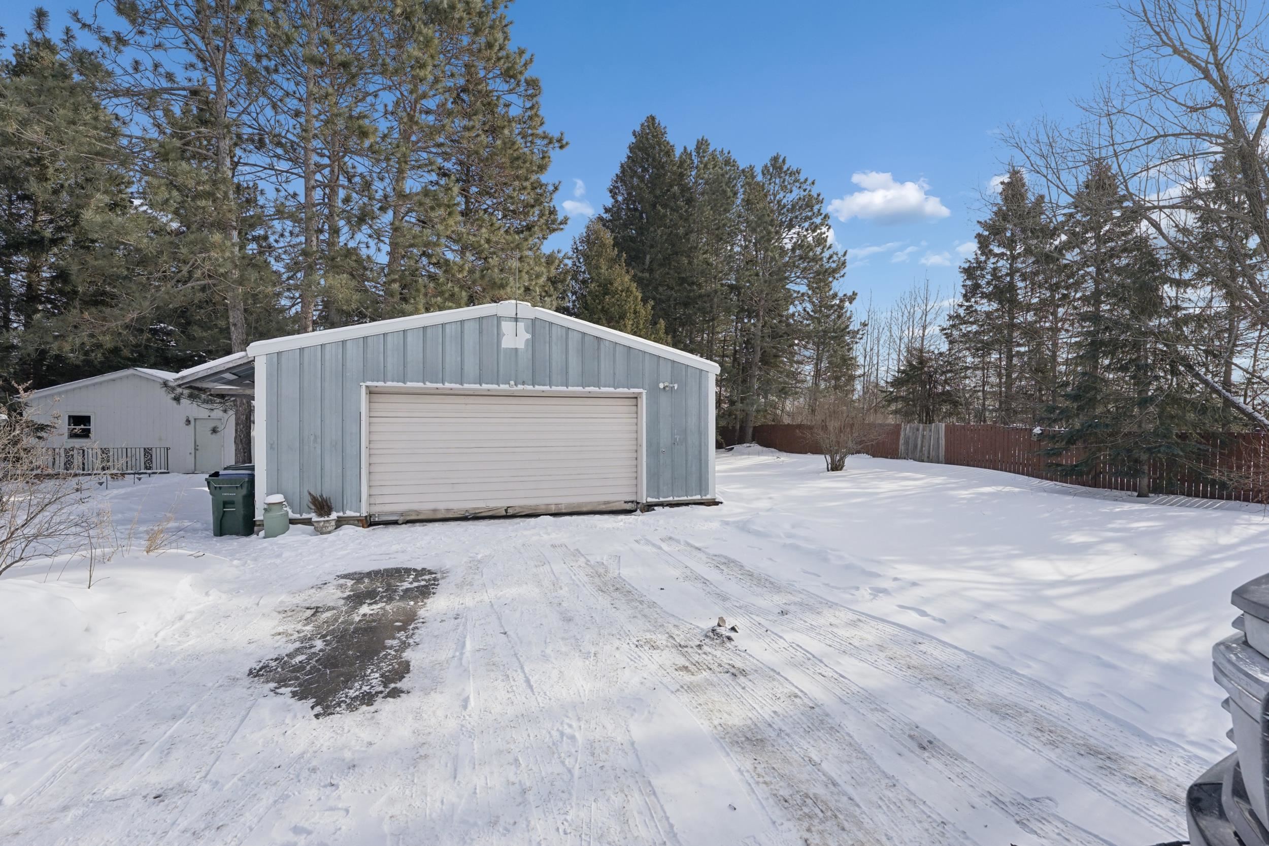 52 Thomson Road Esko, MN 55733 - Photo 20 of 20 Snow covered garage with a garage