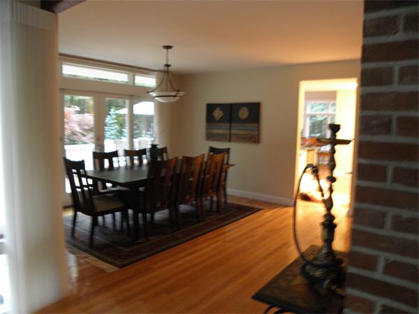 166 Hickory Road Weston, MA 02493 - Photo 3 of 9 a view of a dining room with furniture and wooden floor