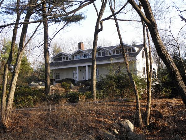 166 Hickory Road Weston, MA 02493 - Photo 5 of 9 a view of a house with a tree in the forest