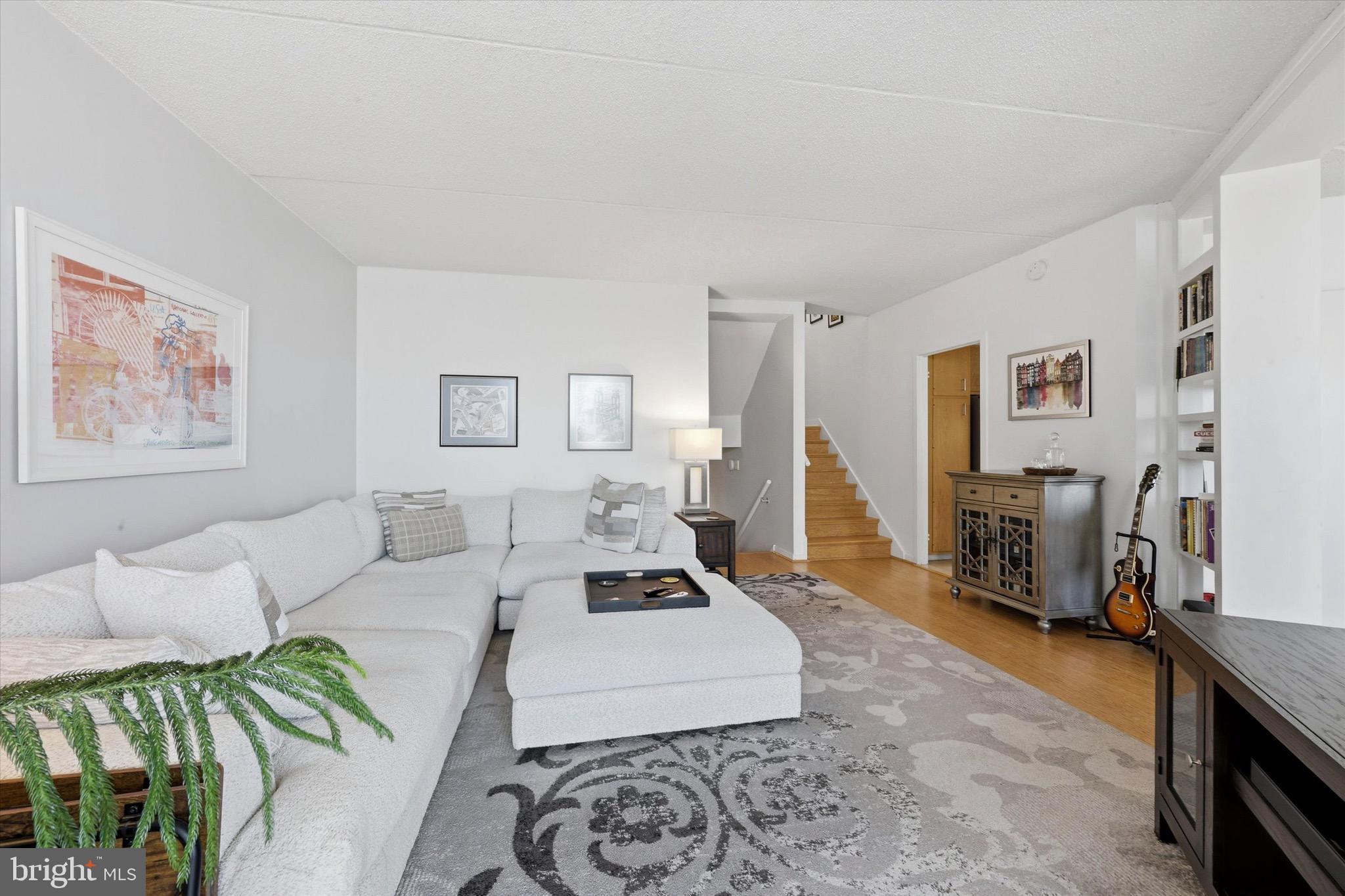 2301 Cherry Street, Unit 4A Philadelphia, PA 19103 - Photo 1 of 25 a living room with furniture and a flat screen tv