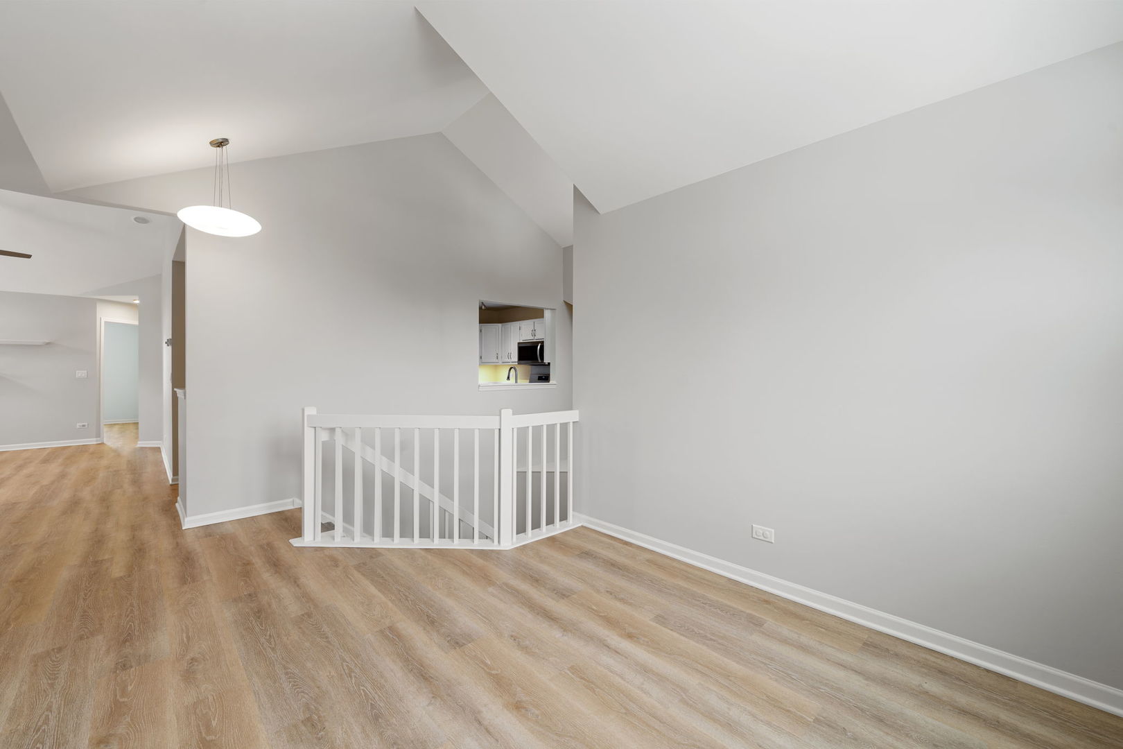 1264 Rhodes Lane Naperville, IL 60540 - Photo 12 of 35 a view of an empty room with wooden floor