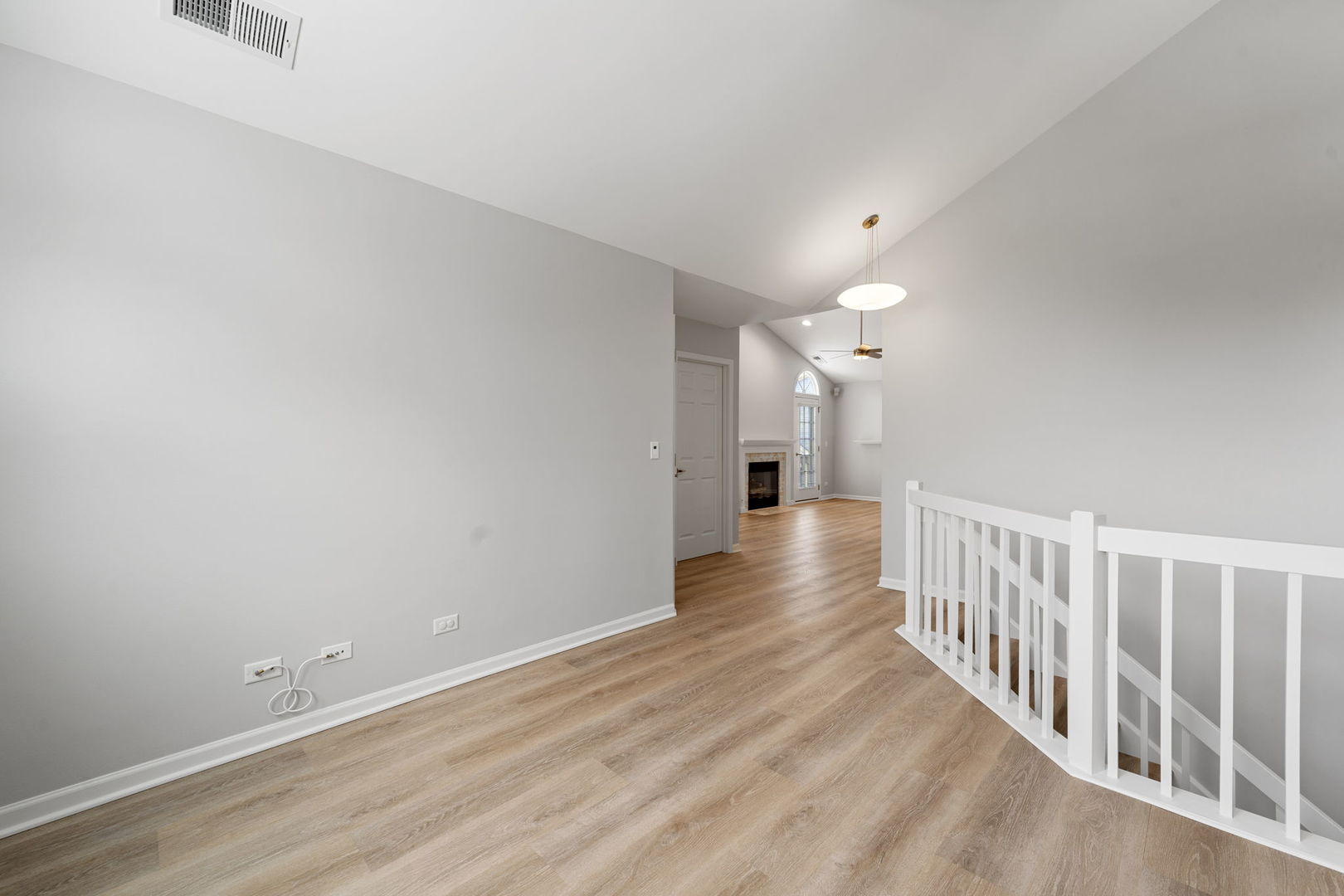1264 Rhodes Lane Naperville, IL 60540 - Photo 13 of 35 a view of a hallway with wooden floor
