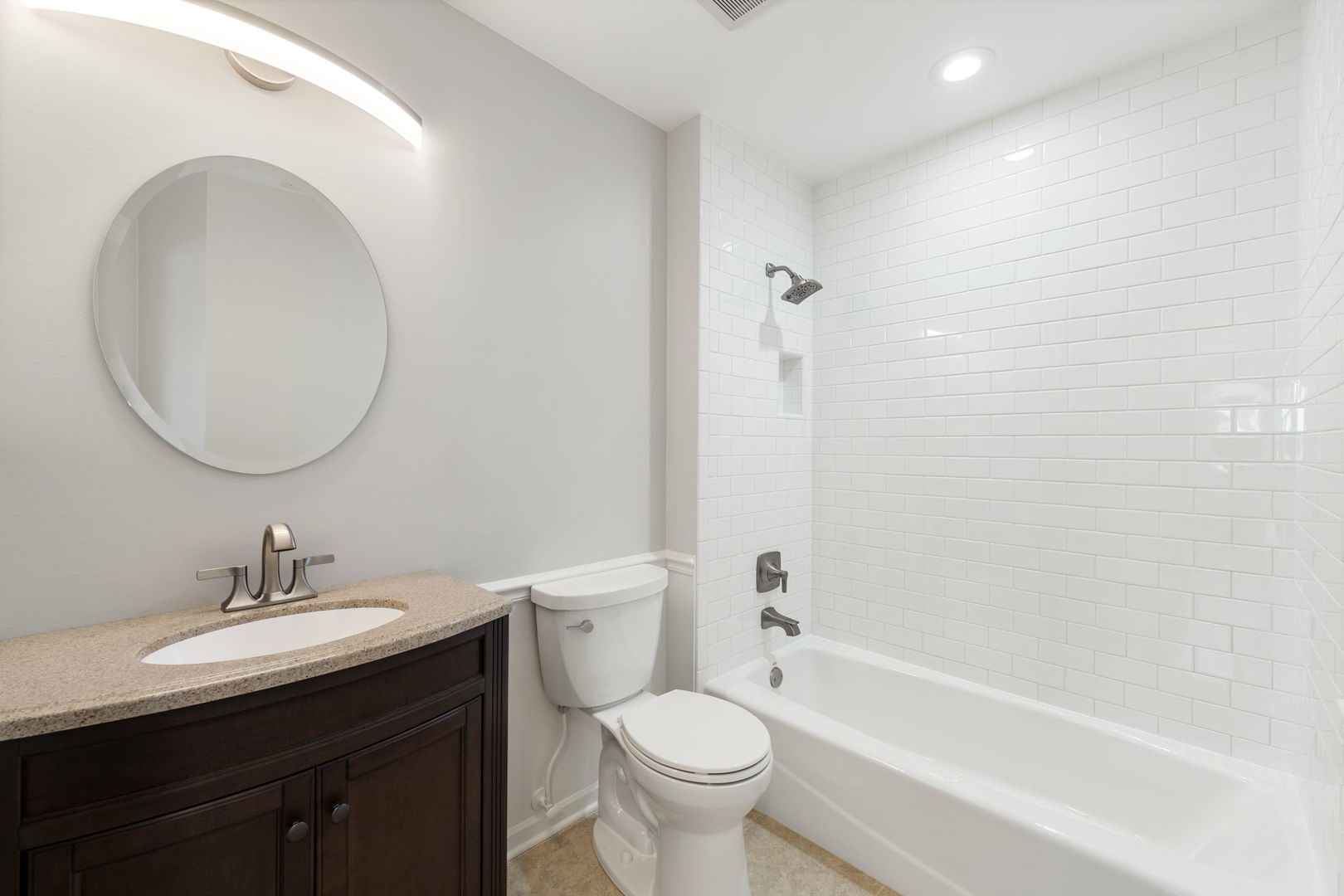 1264 Rhodes Lane Naperville, IL 60540 - Photo 17 of 35 a bathroom with a sink a toilet and a mirror