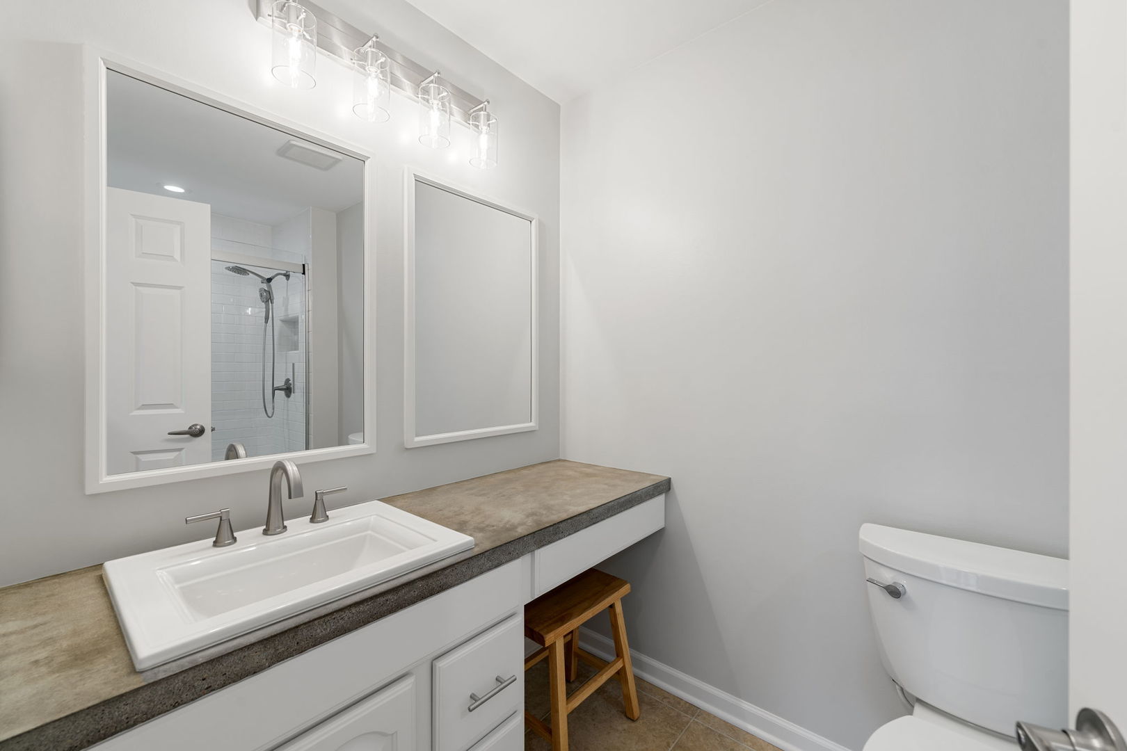 1264 Rhodes Lane Naperville, IL 60540 - Photo 18 of 35 a bathroom with a granite countertop sink a toilet and a mirror
