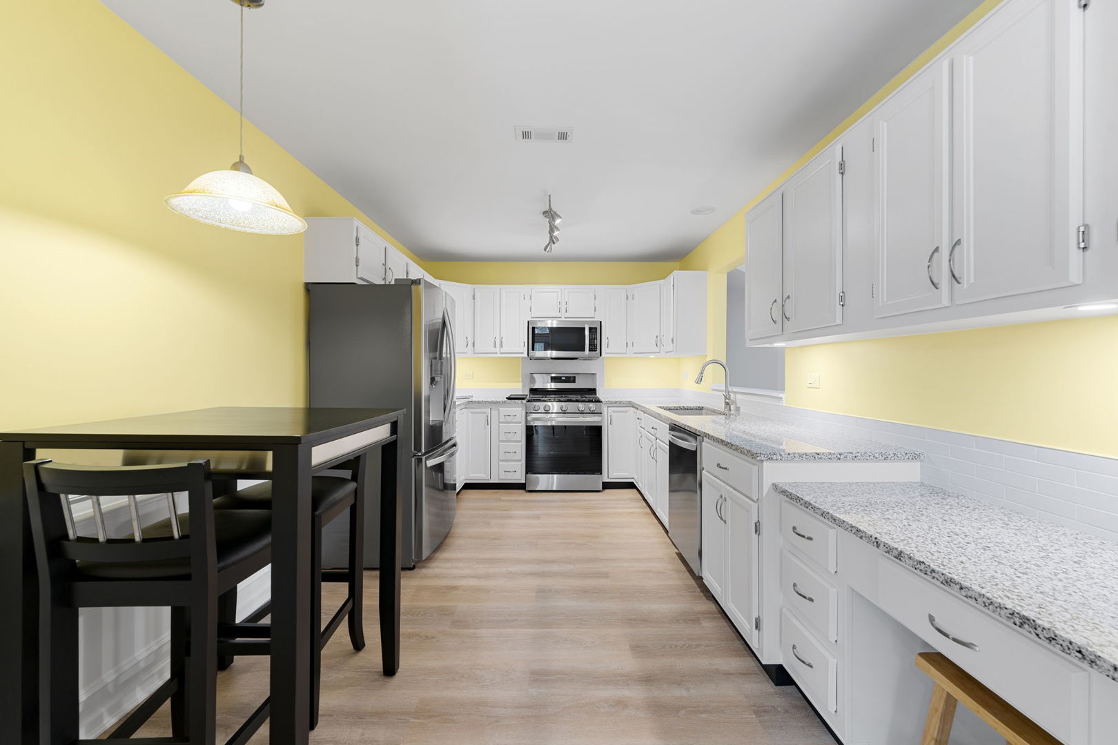 1264 Rhodes Lane Naperville, IL 60540 - Photo 21 of 35 a kitchen with granite countertop a sink appliances cabinets and counter space